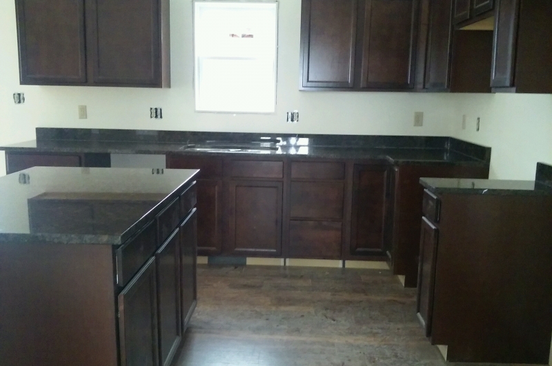 Cabinets with granite tops.